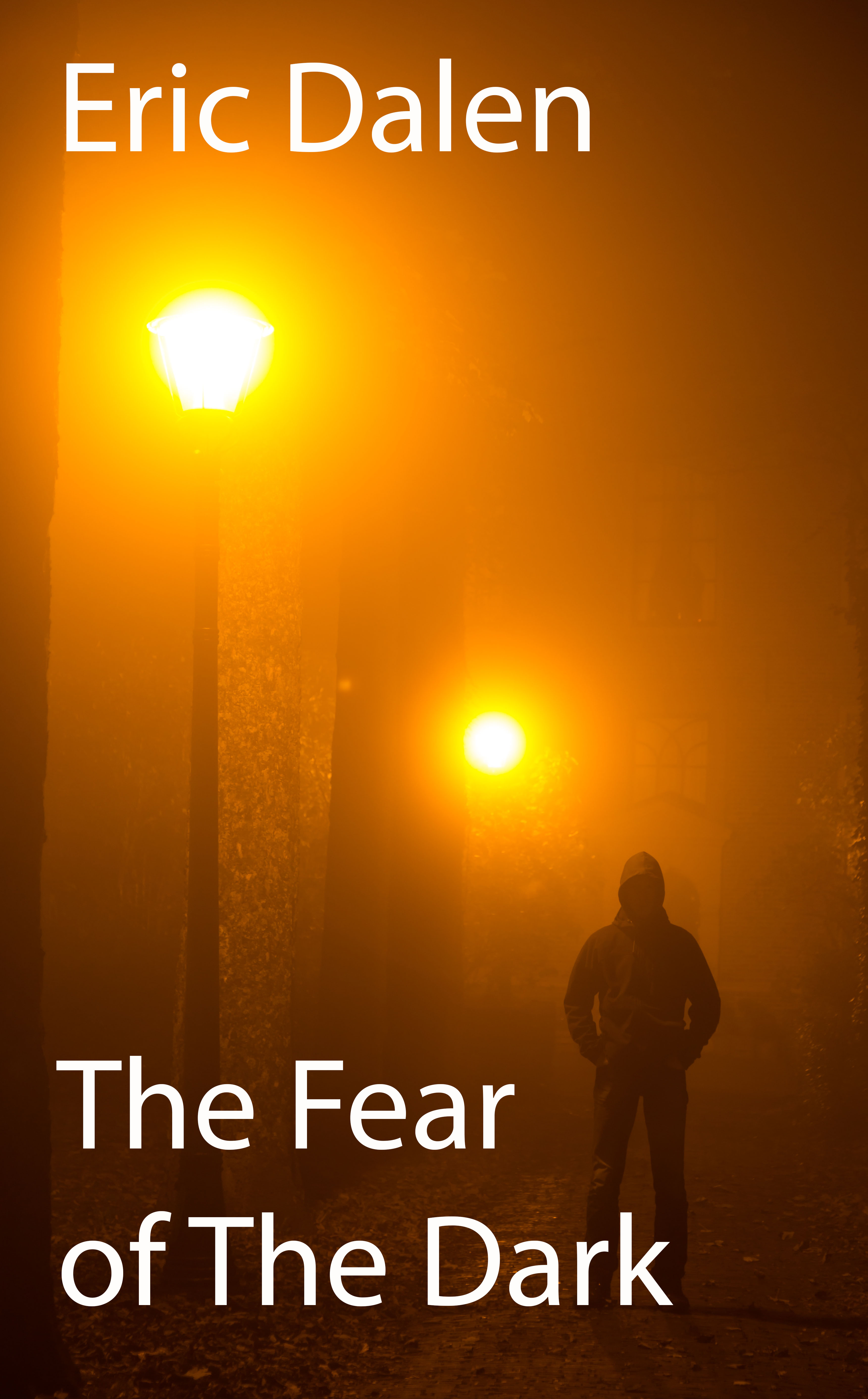 Man alone standing in the middle of a lane on a foggy night.